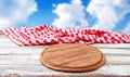 Empty desk of pizza and red tableclothes on wooden table Royalty Free Stock Photo