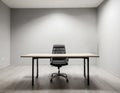 Empty desk in small office room with grey walls Royalty Free Stock Photo