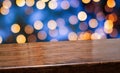 Empty diagonal dark wood table with blur night lights in blue sky bokeh background,banner mockup template for display of product