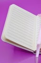 empty diary on purple background Royalty Free Stock Photo
