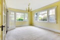 Empty dinning room with cream carpet and yellow walls. Royalty Free Stock Photo