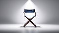 Empty directors chair in spotlight in studio background Royalty Free Stock Photo