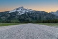 Empty dirt road leading into Grand Tetons National Park Royalty Free Stock Photo