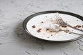 Empty dirty plate with some dessert crumbs Royalty Free Stock Photo