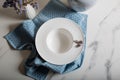 Empty dish plate ready for serving with jug and little flowers Royalty Free Stock Photo