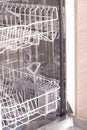 Empty dishwasher in kitchen Royalty Free Stock Photo