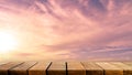 Empty display wooden shelf table counter with copy space for advertising backdrop and background with pink sunset sky