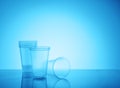 Empty disposable plastic cups on blue background Royalty Free Stock Photo