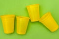 Empty disposable yellow plastic cups