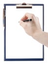 Empty document in a clipboard with a Hand holding a pen isolated Royalty Free Stock Photo