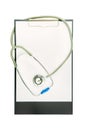 Empty document in a clipboard with stethoscope isolated on white Royalty Free Stock Photo