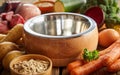 Empty dog bowl surrounded by fresh ingredients