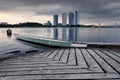 Empty dragon boat anchored near the lake side over sunrise background