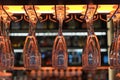 Empty drinking glasses hanging in bar rack at night Royalty Free Stock Photo