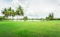 Empty dry cracked swamp reclamation soil, land plot for housing construction Green meadow, beautiful views and beautiful blue sky Royalty Free Stock Photo