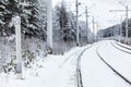 Empty electric mainline railway in winter Royalty Free Stock Photo