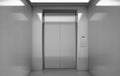 Empty elevator cabin with closed steel doors