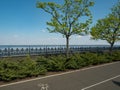 Empty embankment with bike lane green trees