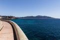 empty embankment and distant mountains at sea