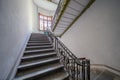 Empty entrance in apartment building stairwell stairs