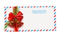 Empty envelope with red and blue borders and stamp tied with ribbon bow and Christmas decorations Royalty Free Stock Photo