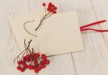 Empty envelopes with red rowan and stripe.White wooden table.Space for text