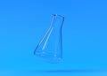 Empty erlenmeyer flask flies on blue background