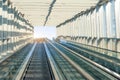 Empty escalator going down background, concept of the movement path. Moving waklway in the airport rail road terminal, travel Royalty Free Stock Photo