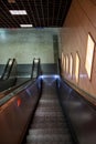 The empty escalator going down inside the building Royalty Free Stock Photo