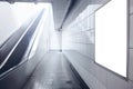 An empty escalator in a modern subway station, quietly spiraling downwards, devoid of any human presence Royalty Free Stock Photo