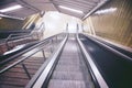 Empty escalator and stair in pedestrian subway railway station. Royalty Free Stock Photo