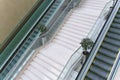 Empty escalator and stairs in a business center, shopping mall or airport. Silence, emptiness, architecture. Royalty Free Stock Photo