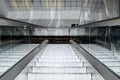 Empty escalator stairs moving up in modern office