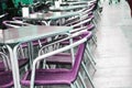 Empty European street cafe with purple chairs and tables, selective focus Royalty Free Stock Photo