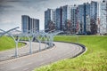 Empty expressway of the western high-speed diameter in st. petersburg in clear sunny weather, green lawns along the road