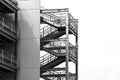 Empty external metal fire escape stairs construction out side of modern building with copy space. Royalty Free Stock Photo