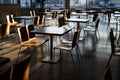 Empty fast-food restaurant lit by morning sun