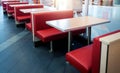 Empty fastfood restaurant interior with red chairs and table Royalty Free Stock Photo