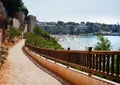 Empty fenced walkway leading to the Cabo Roig beach