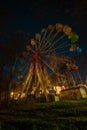 Empty Ferris wheel at night in an amusement park Royalty Free Stock Photo