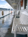 Empty ferry deck with benches overlooking the ocean Royalty Free Stock Photo