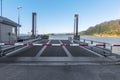 Empty Ferry terminal with metal ramp and cosed turnpike. Norway