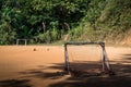 Empty field with worn out goal nets and footballs Royalty Free Stock Photo