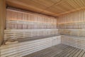 Empty Finnish sauna room. Modern interior of wooden spa cabin with dry steam Royalty Free Stock Photo