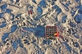 Empty fireworks box abandoned on the sand. Royalty Free Stock Photo