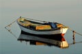 fishing boat and its reflection on the sea Royalty Free Stock Photo