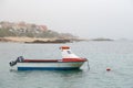 Empty fishing boat in the North Atlantic Ocean on a foggy day in Galicia, Spain Royalty Free Stock Photo