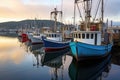 empty fishing boats lined up at harbor Royalty Free Stock Photo