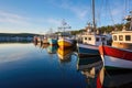 empty fishing boats lined up at harbor Royalty Free Stock Photo