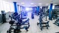 Empty fitness center hall. Modern and empty gym interior with equipment